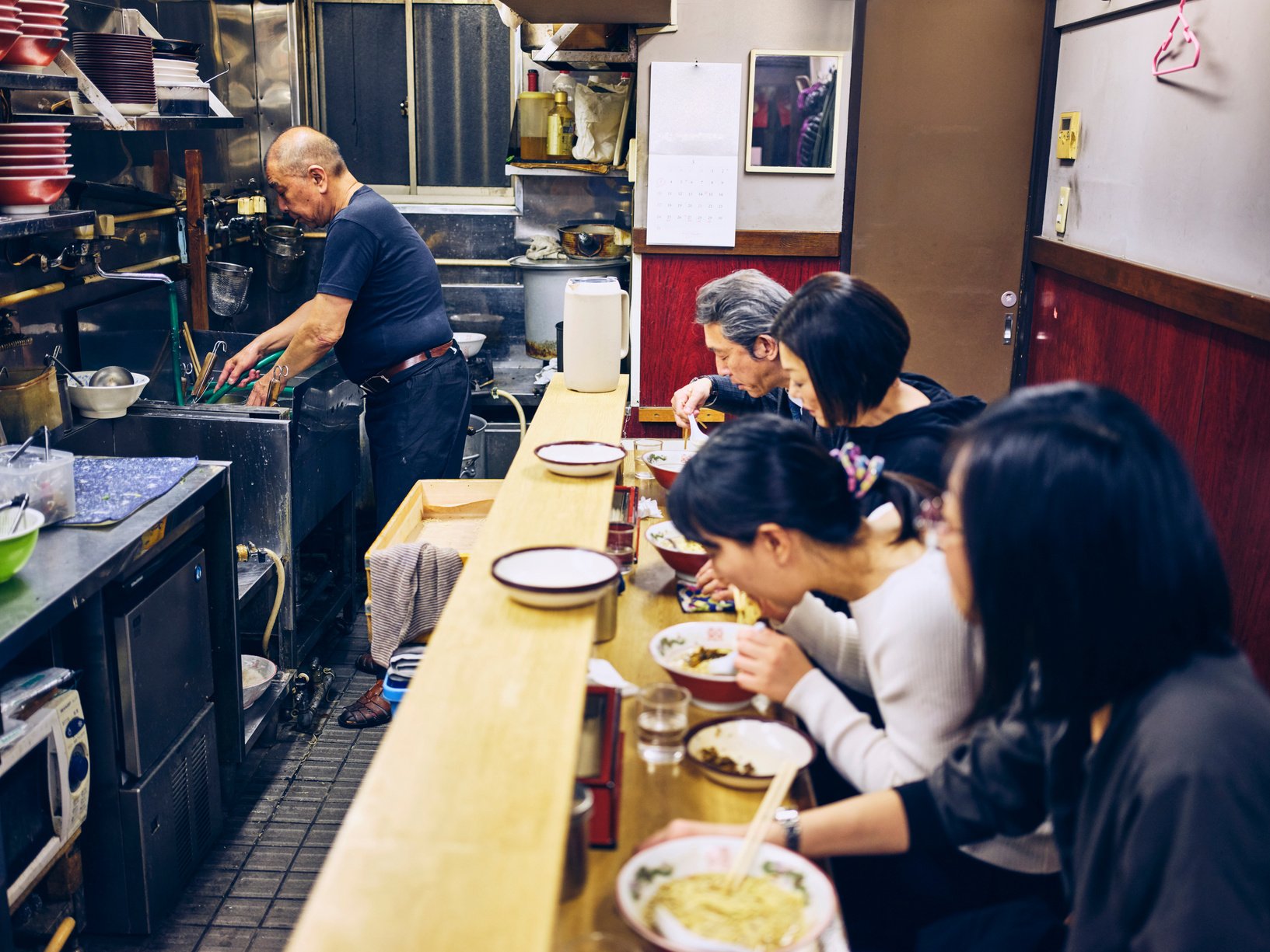 Customers in a Ramen Shop in Tokyo Japan